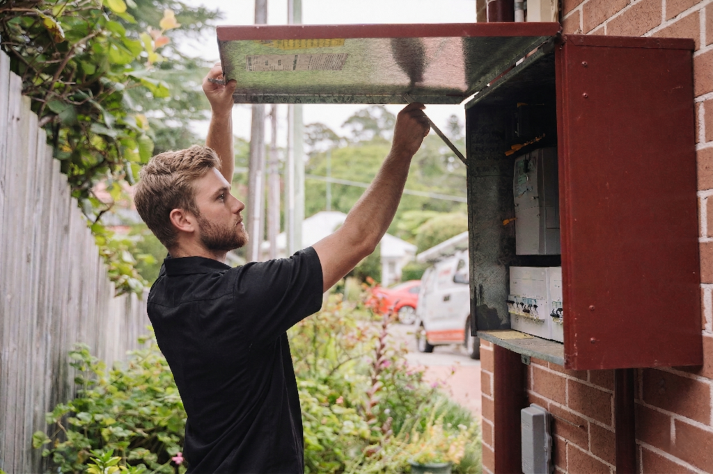 Electrician installing downlights in a Millers Point home